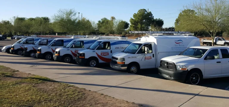 JUST BETTER HVAC TRUCKS IN PARKING LOT